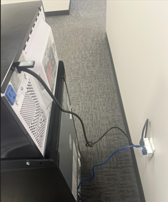 A computer with wires plugged into it

AI-generated content may be incorrect.